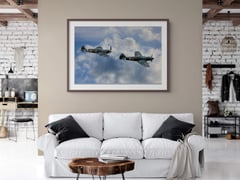 V for Victory! framed at 30 by 45 inches above a white sofa in a brick loft living room. (thumbnail 4)