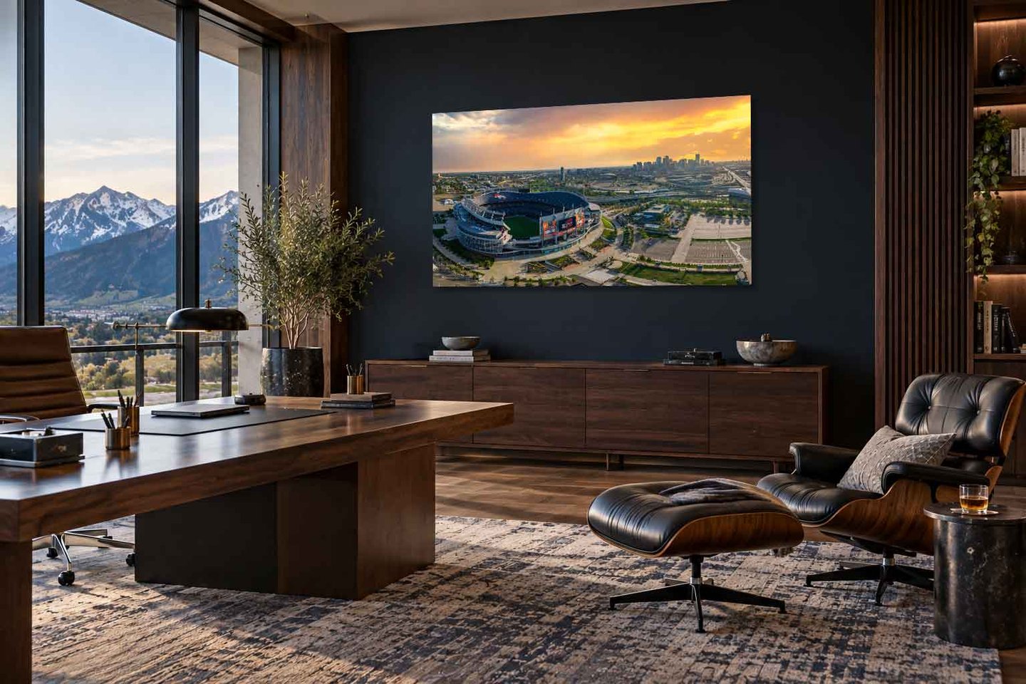 Mile High by Sherry Keene, an aerial Denver stadium Colorado sunrise photograph displayed in an executive office with mountain views.