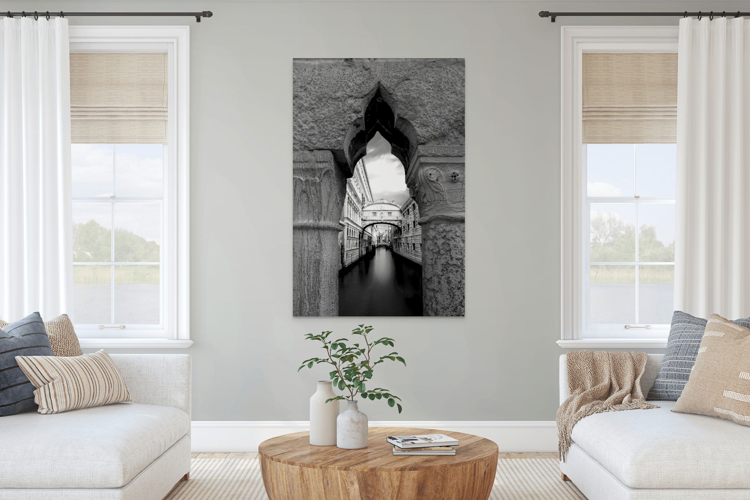 Modern luxury beach house living room with a unique, award-winning black and white print of the Bridge of Sighs by Sherry Keene—fine art photography not found in tourist shops.