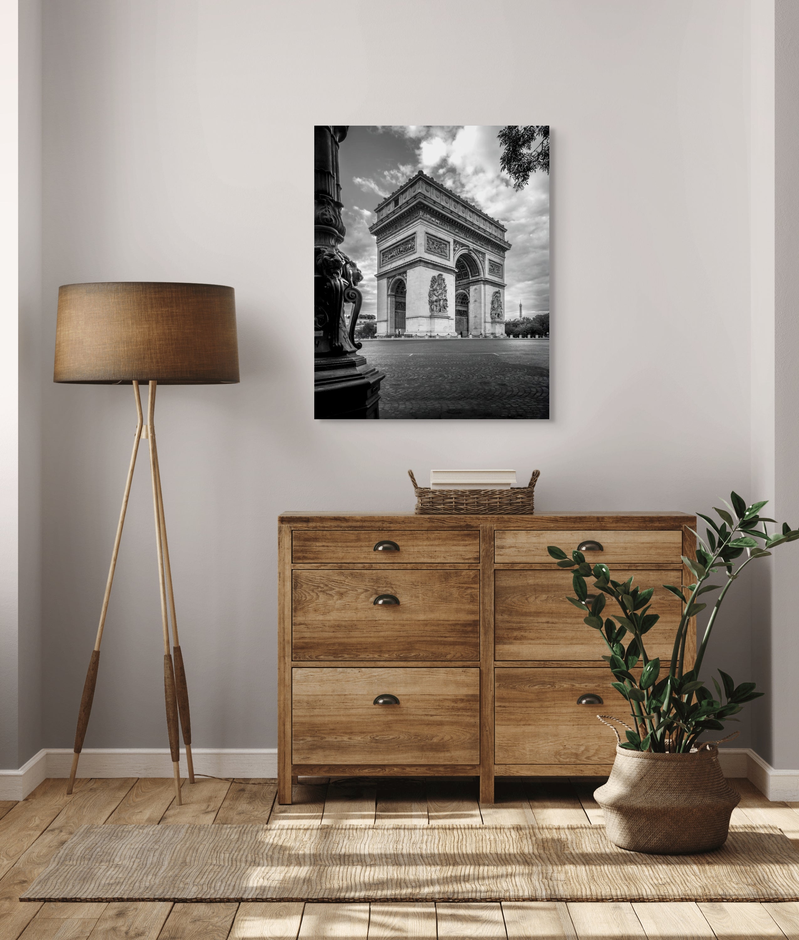 Large-format black and white fine art photograph of the Arc de Triomphe with the Eiffel Tower in the background, displayed in an elegant Parisian bedroom. Captures timeless French architecture with emotional depth and museum-quality detail.